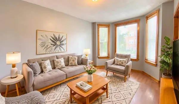 a living room with furniture and a large window