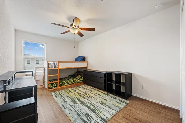 a room with a bed and a chandelier