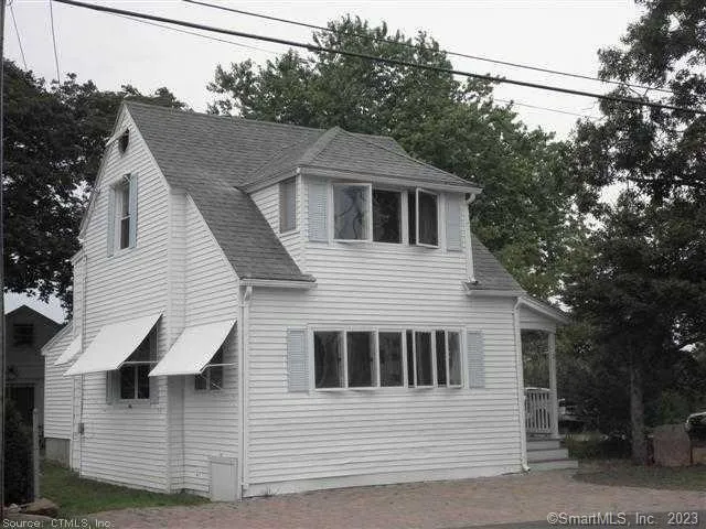 a front view of a house with a garage