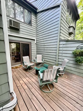 a view of a patio with wooden floor