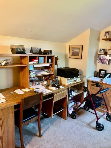 a view of a workspace with furniture