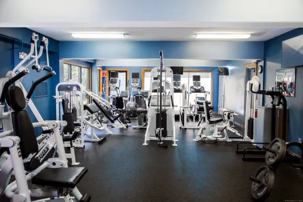 a view of a workspace with furniture