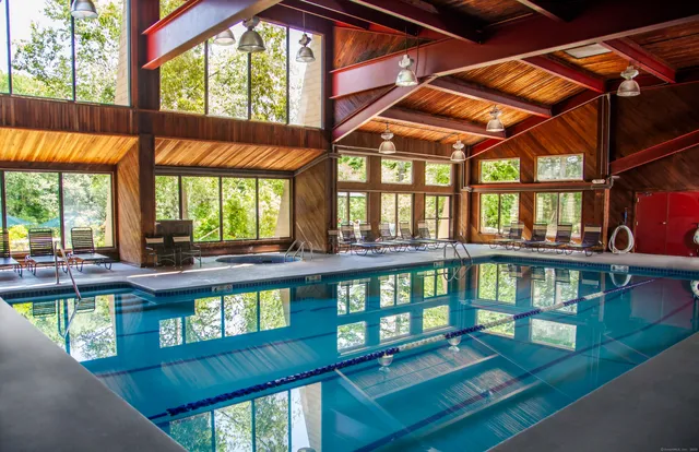 a view of a large swimming pool with a patio