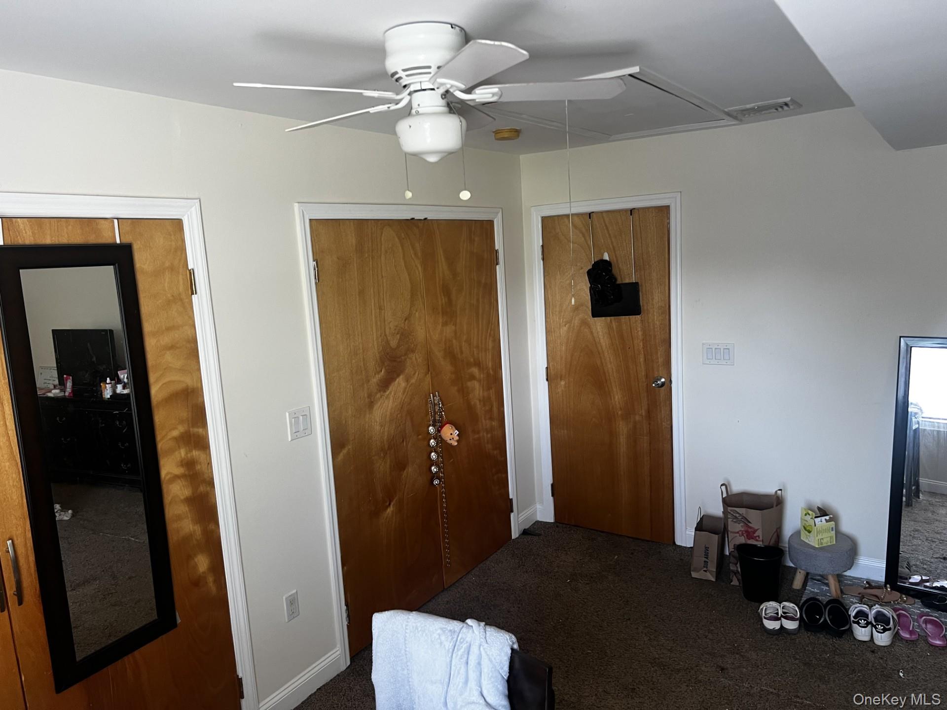 349 County Center Road, Unit TOP White Plains, NY 10603 - Photo 15 of 17 a bedroom with a bed and a chandelier