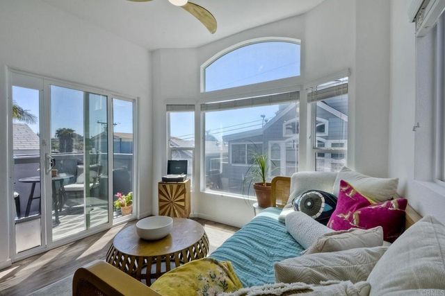 a bathroom with a granite countertop toilet sink and mirror