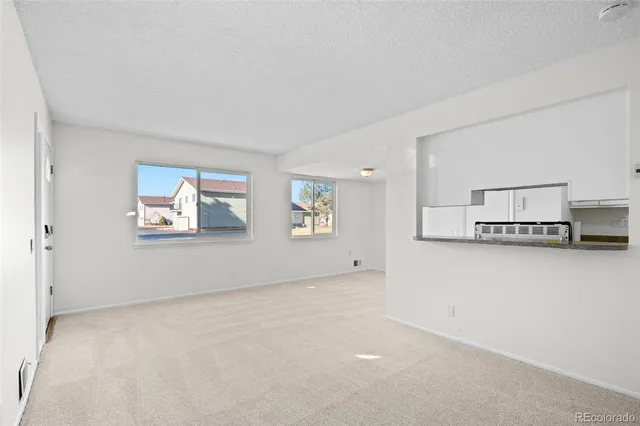 a view of a refrigerator in a kitchen
