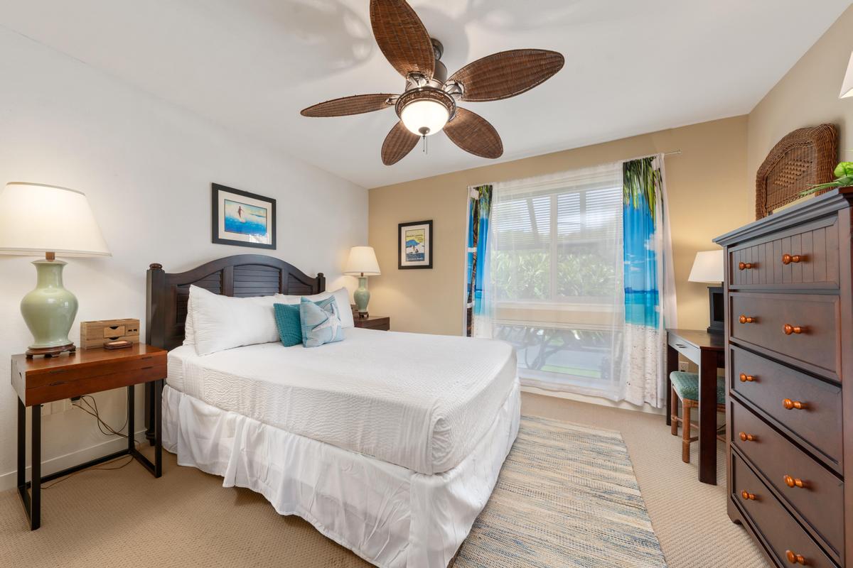 68-1122 Na Ala Hele Road, Unit H22 Kamuela, HI 96743 - Photo 16 of 30 a spacious bedroom with a bed and a chandelier