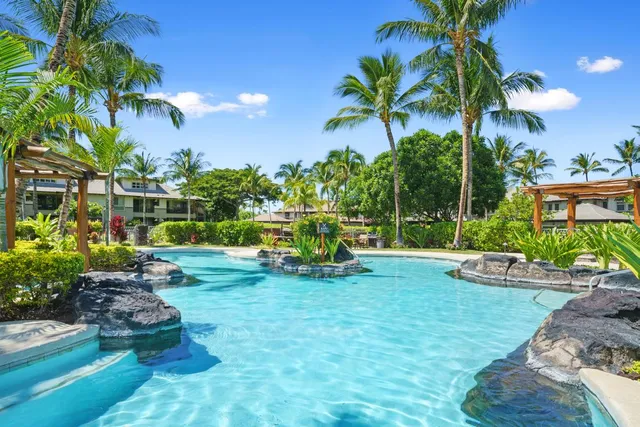 a view of a chair and tables in the patio