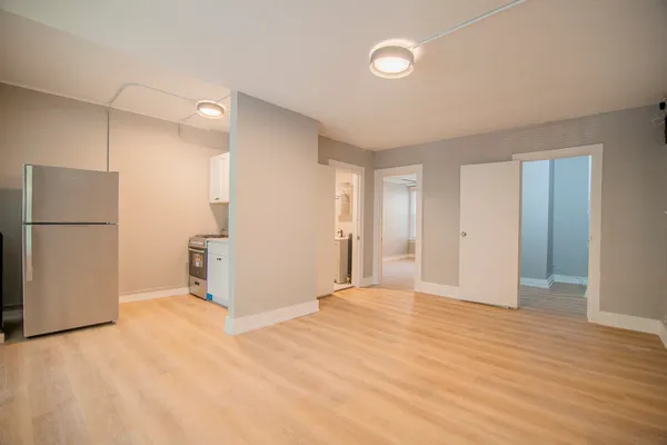 a view of a livingroom with a refrigerator