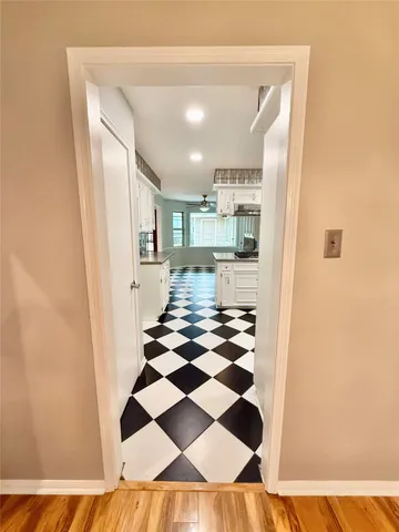 a kitchen with a stove a sink and a refrigerator