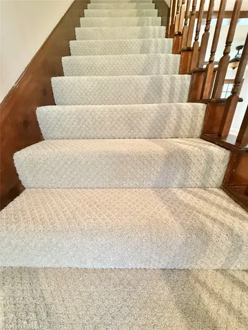 a view of an empty room with a cabinet