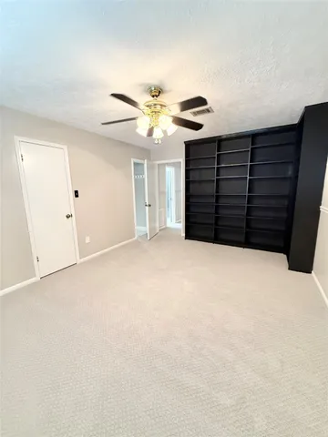 a white bath tub sitting next to a white sink