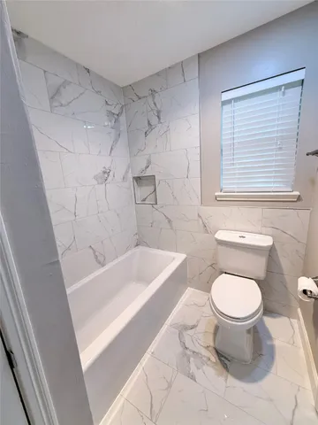 a spacious bathroom with a double vanity sink and a large mirror