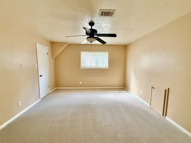 a view of backyard with swimming pool