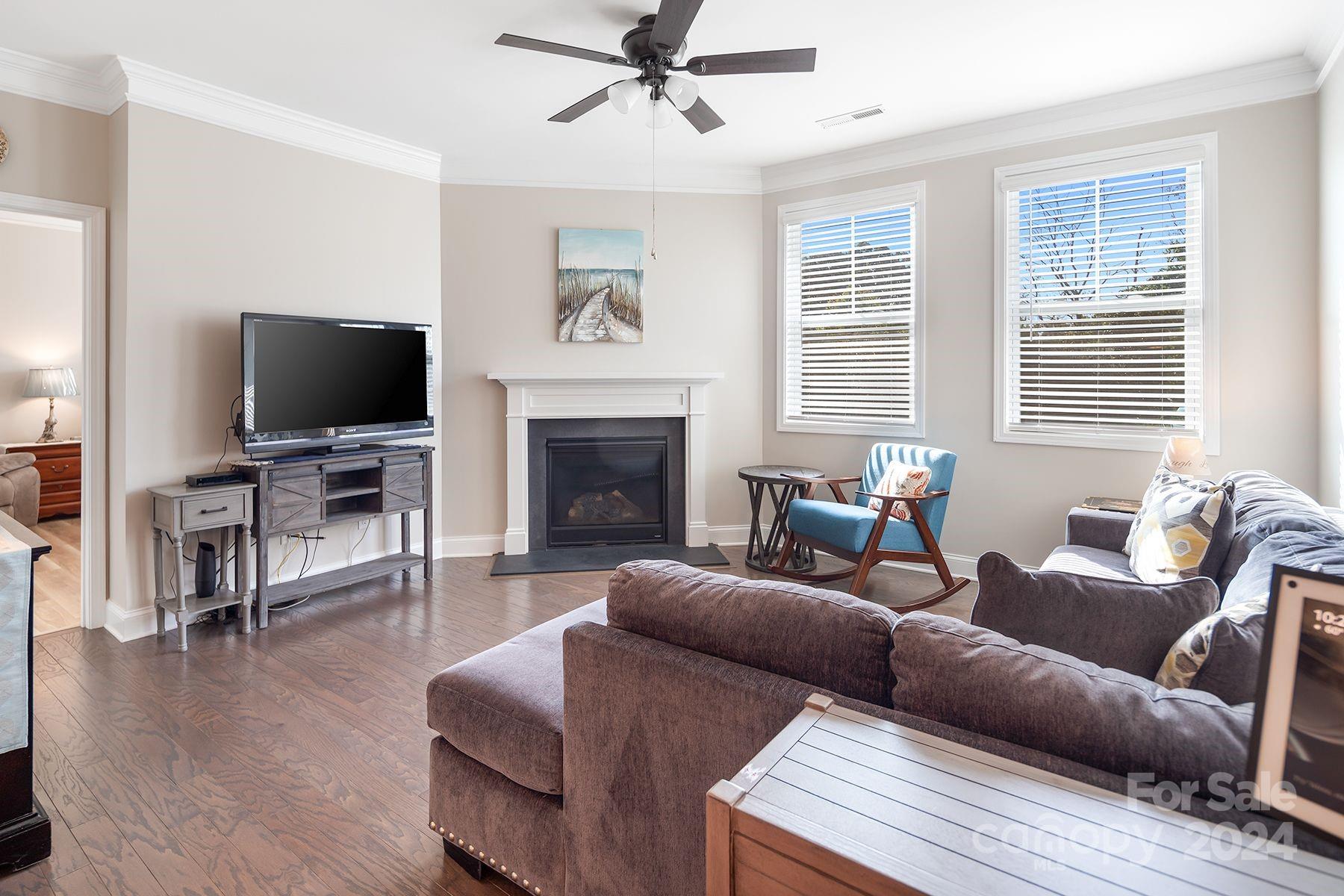 118 East Northstone Road Mooresville, NC 28115 - Photo 11 of 33 a living room with furniture a flat screen tv and a fireplace