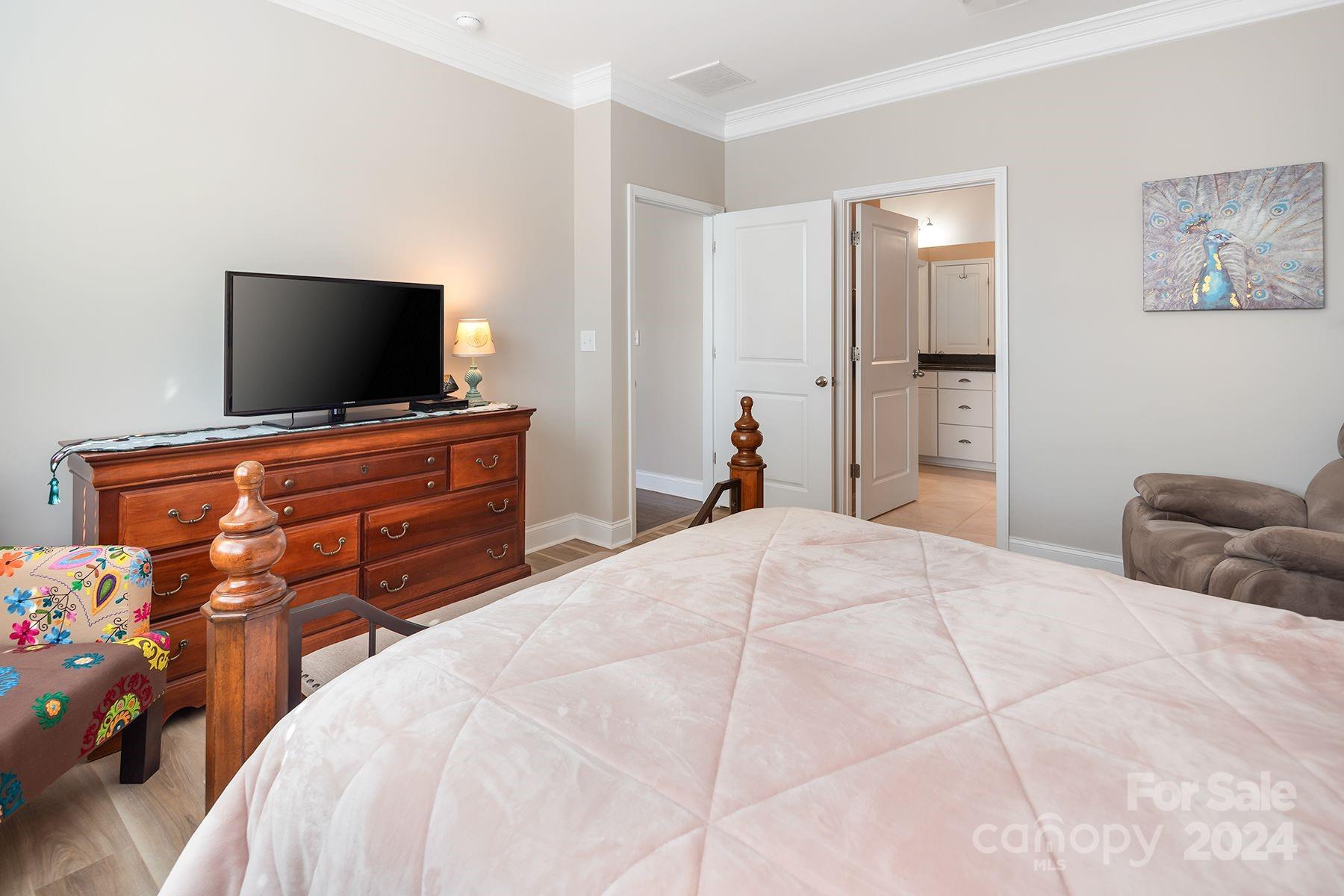118 East Northstone Road Mooresville, NC 28115 - Photo 14 of 33 a bedroom with a bed and a flat screen tv