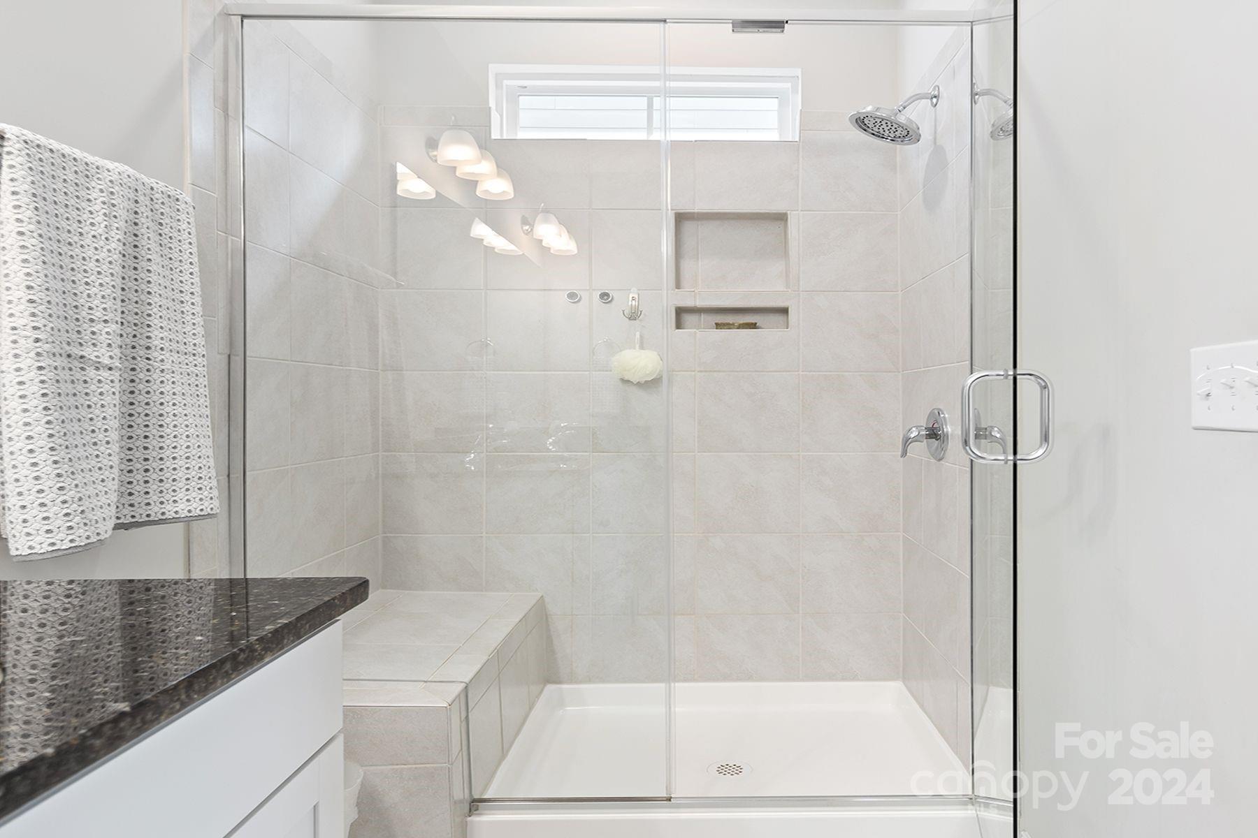 118 East Northstone Road Mooresville, NC 28115 - Photo 17 of 33 a bathroom with a granite countertop sink a toilet and shower