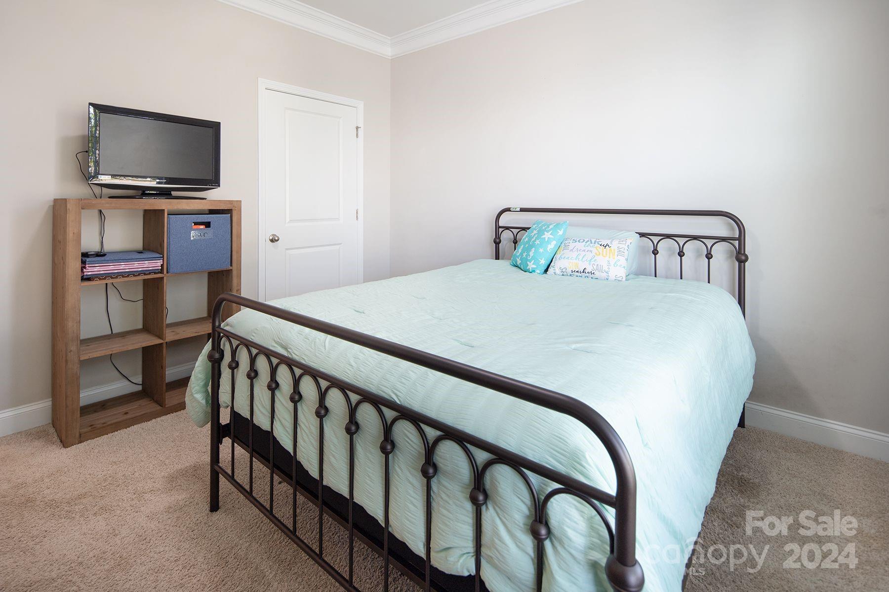 118 East Northstone Road Mooresville, NC 28115 - Photo 19 of 33 a bedroom with a bed and flat screen tv