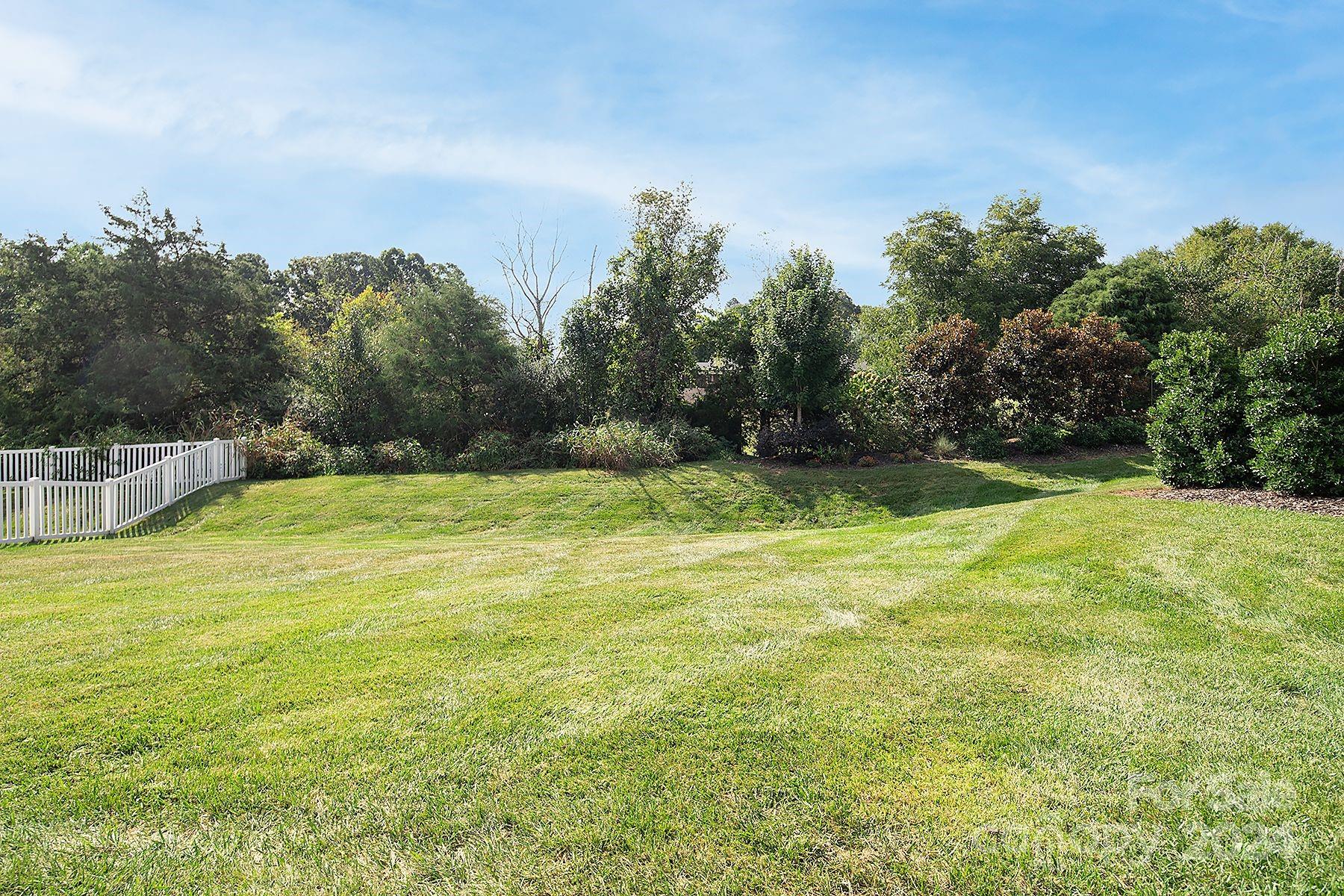 118 East Northstone Road Mooresville, NC 28115 - Photo 25 of 33 a view of a swimming pool with a yard