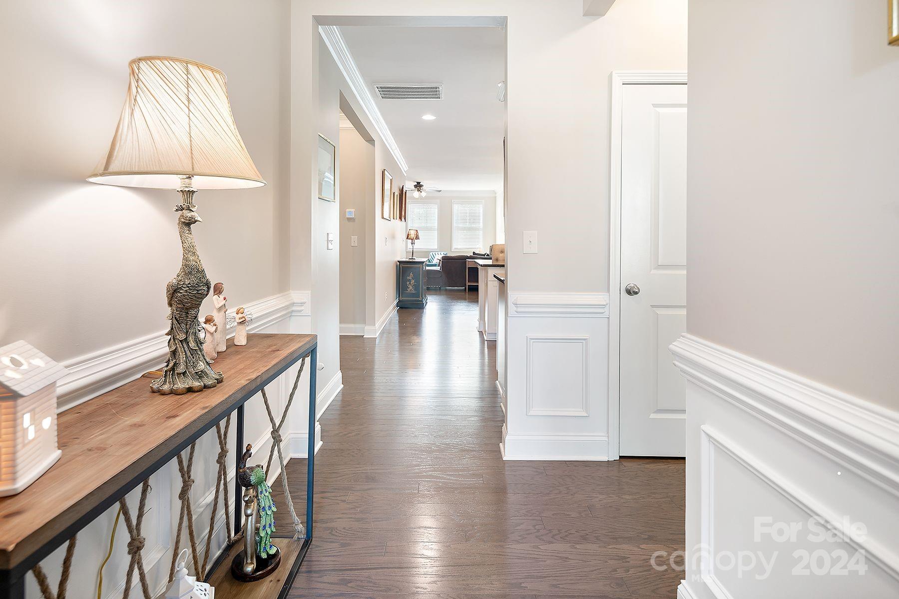 118 East Northstone Road Mooresville, NC 28115 - Photo 3 of 33 a view of a hallway with wooden floor and staircase