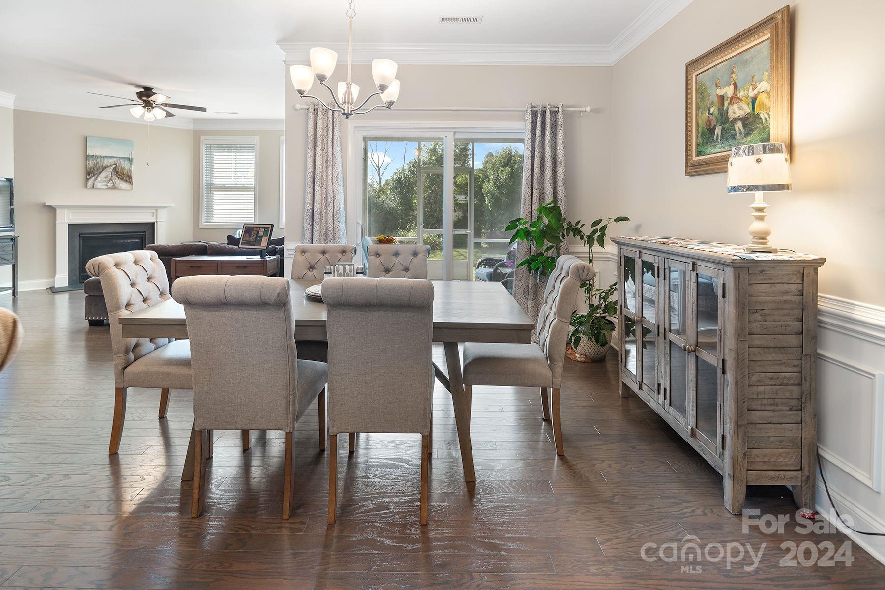 118 East Northstone Road Mooresville, NC 28115 - Photo 9 of 33 a view of a dining room with furniture window and wooden floor