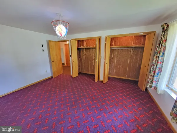 a view of empty room with a fireplace