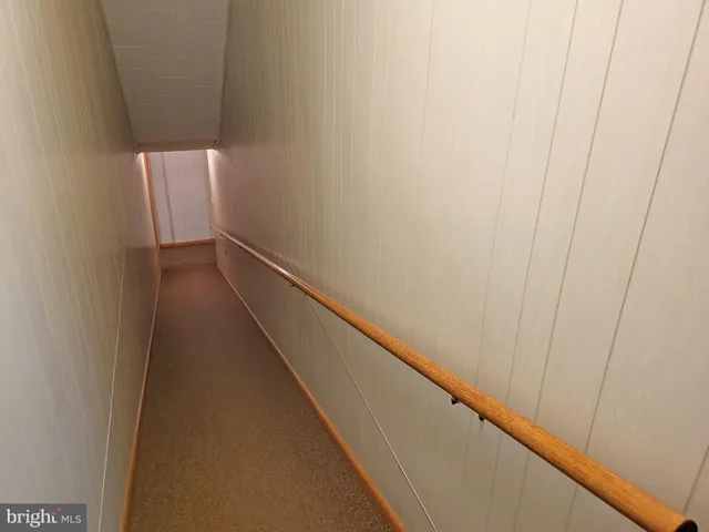 a view of hallway with wooden floor