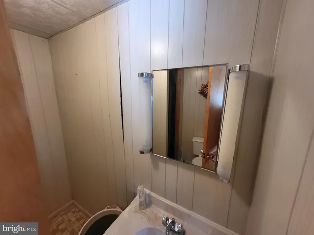 a bathroom with a shower and a sink