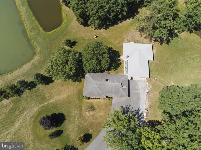 a aerial view of a house with a yard