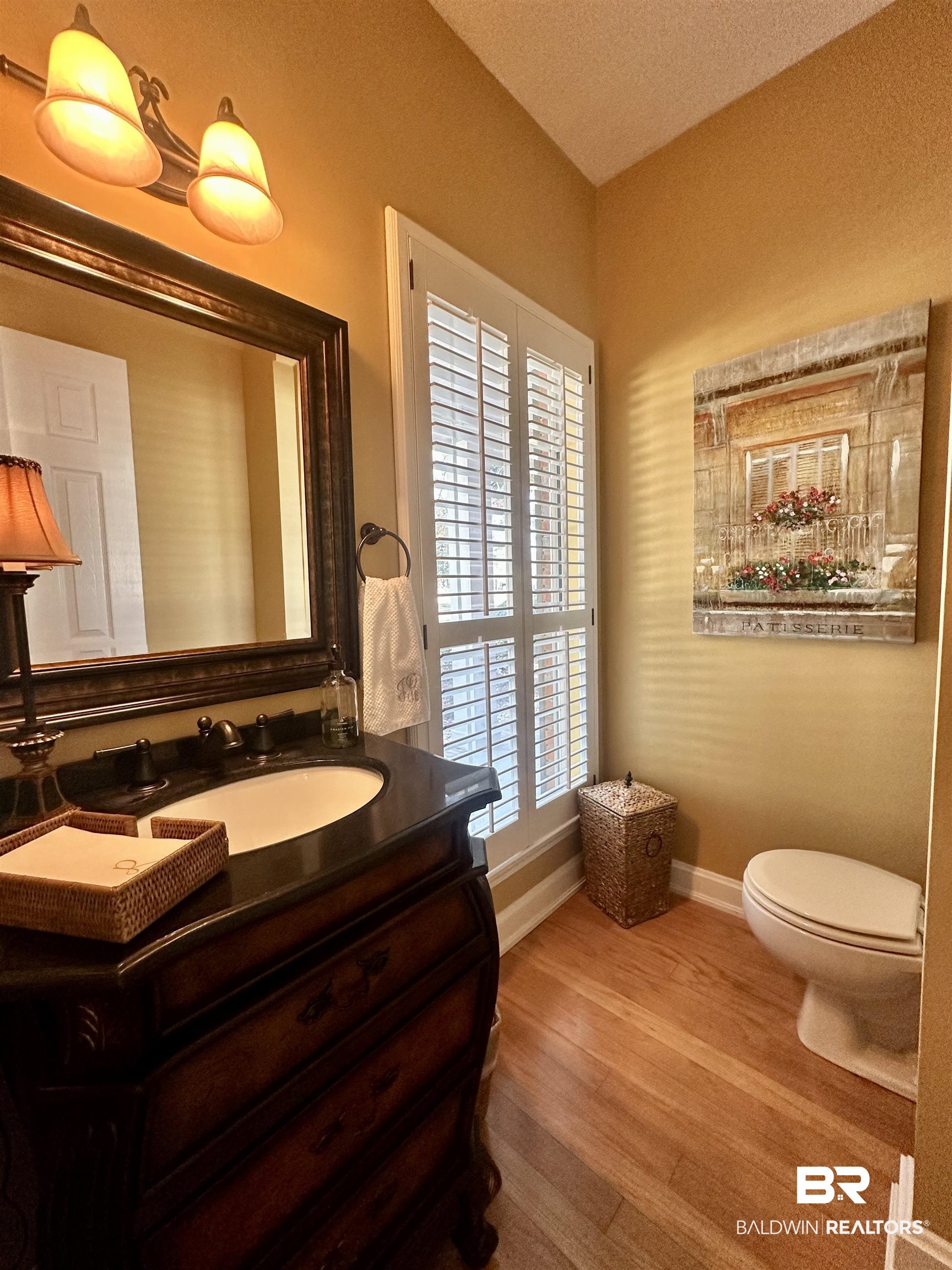 148 Brooks Boulevard Brewton, AL 36426 - Photo 16 of 45 Bathroom featuring toilet, vanity, baseboards, and wood finished floors