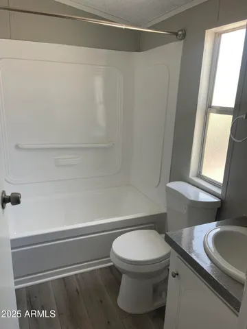 a bathroom with a toilet and a sink
