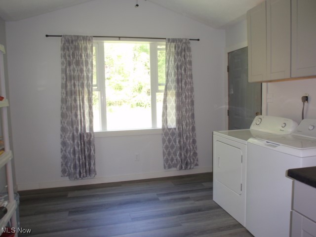 14203 Darrow Road Vermilion, OH 44089 - Photo 5 of 26 Laundry room featuring washer and dryer, wood finished floors, healthy amount of natural light, and baseboards
