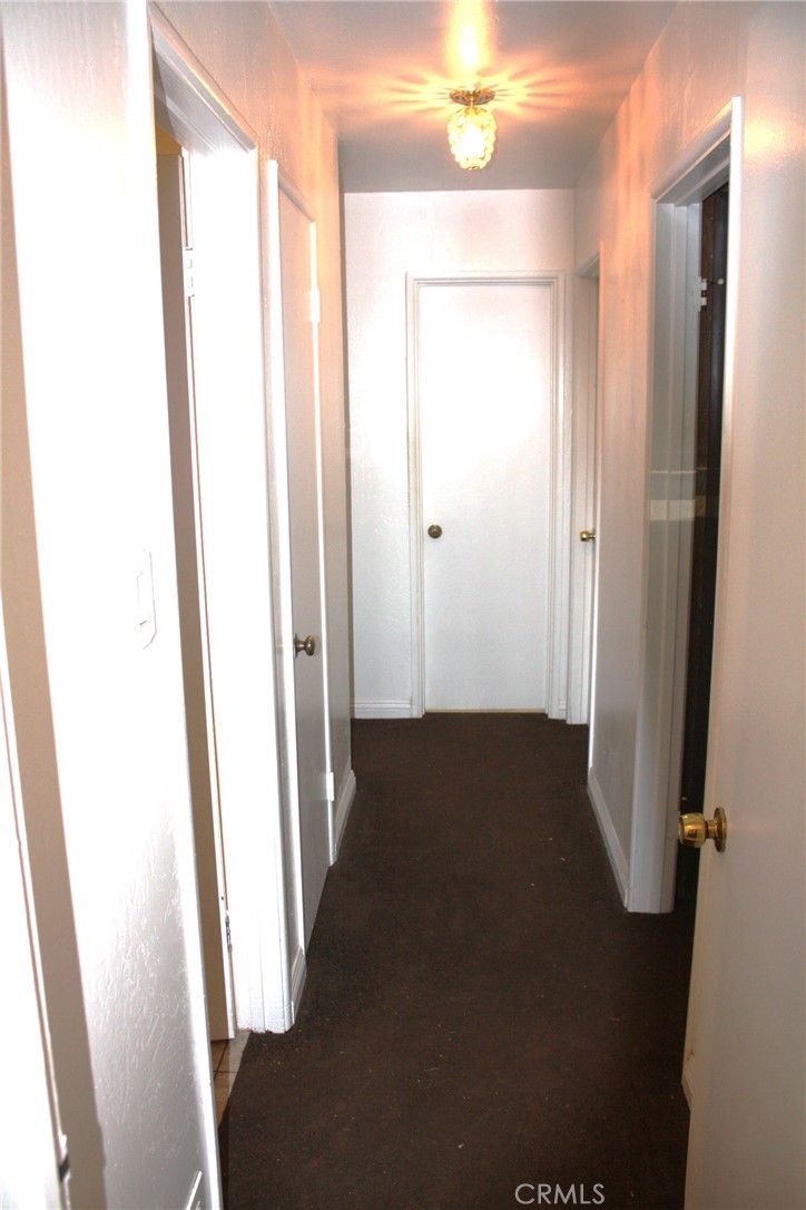 6458 Rhonda Road Riverside, CA 92504 - Photo 19 of 47 a view of a hallway with wooden floor