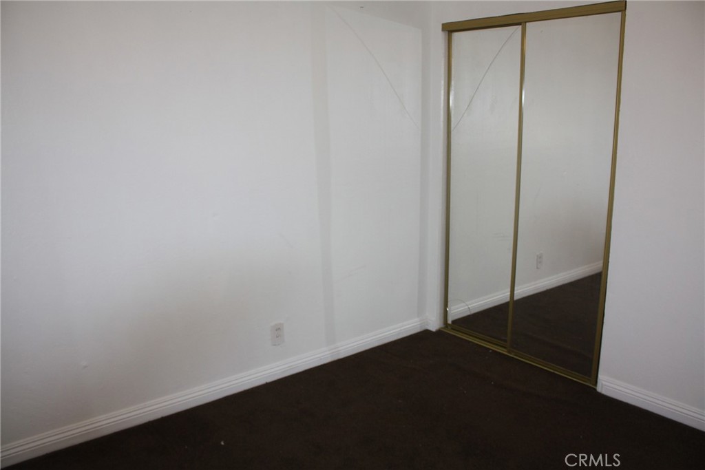 6458 Rhonda Road Riverside, CA 92504 - Photo 24 of 47 an empty room with wooden floor