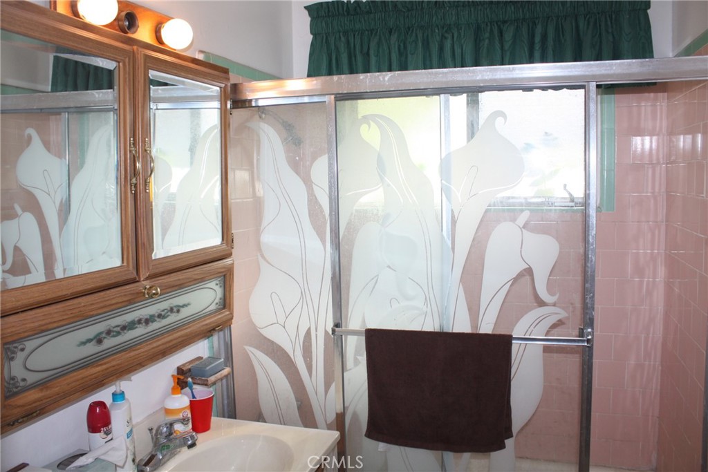 6458 Rhonda Road Riverside, CA 92504 - Photo 25 of 47 a bathroom with a bathtub and a shower