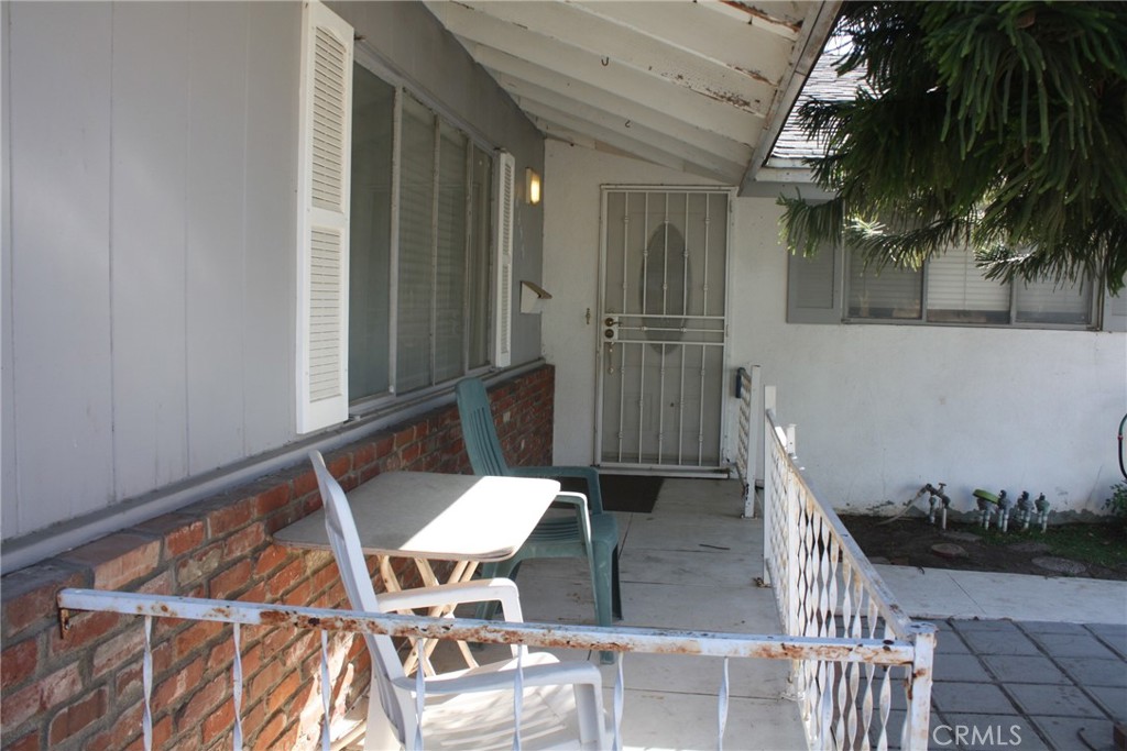 6458 Rhonda Road Riverside, CA 92504 - Photo 6 of 47 a balcony with table and chairs