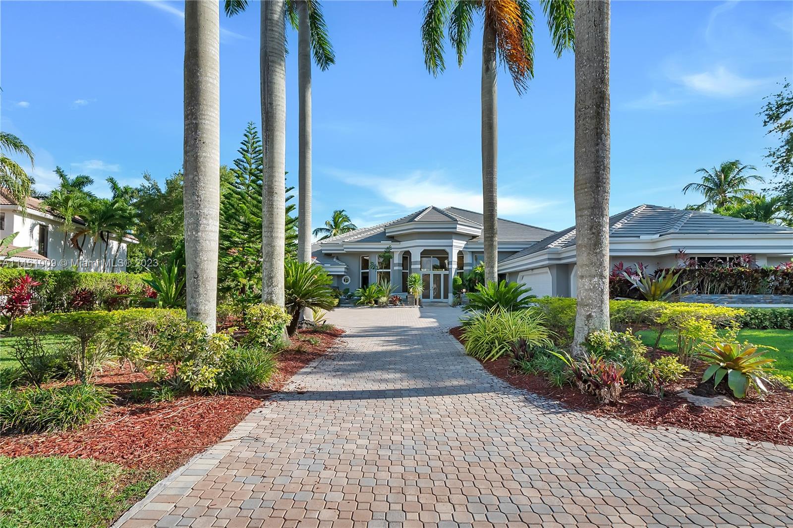 3088 Birkdale Drive Weston, FL 33332 - Photo 1 of 41 a front view of a building with garden