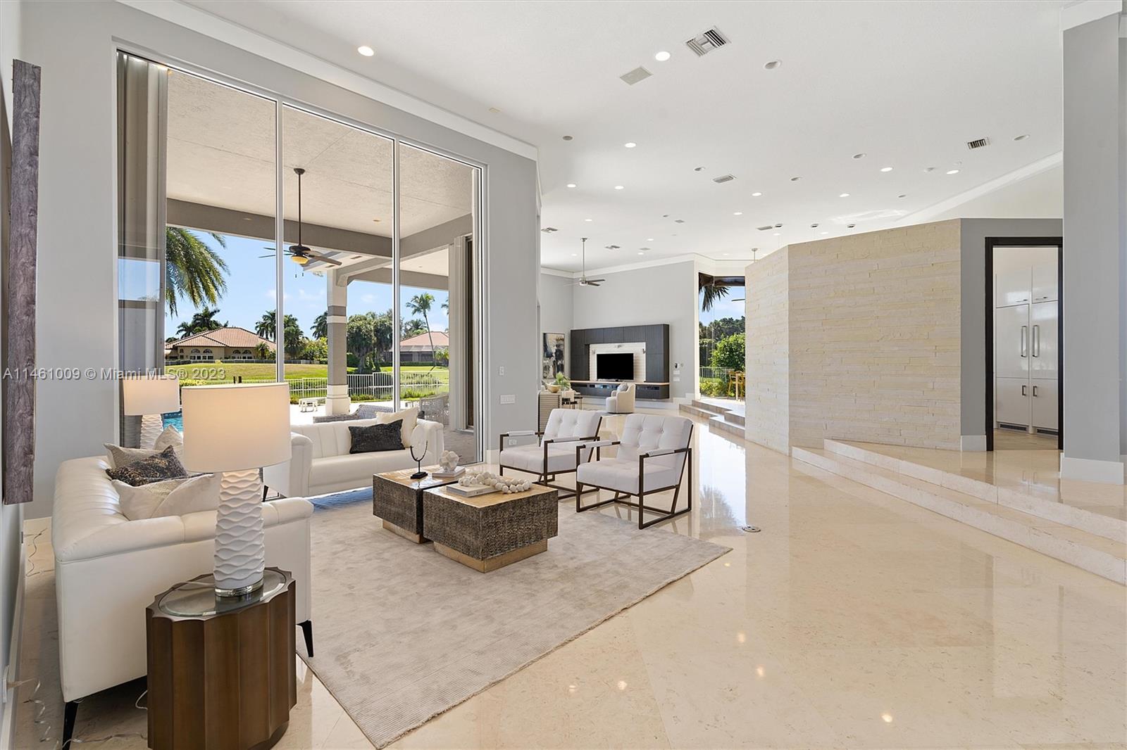 3088 Birkdale Drive Weston, FL 33332 - Photo 12 of 41 a living room with fireplace furniture and a large window