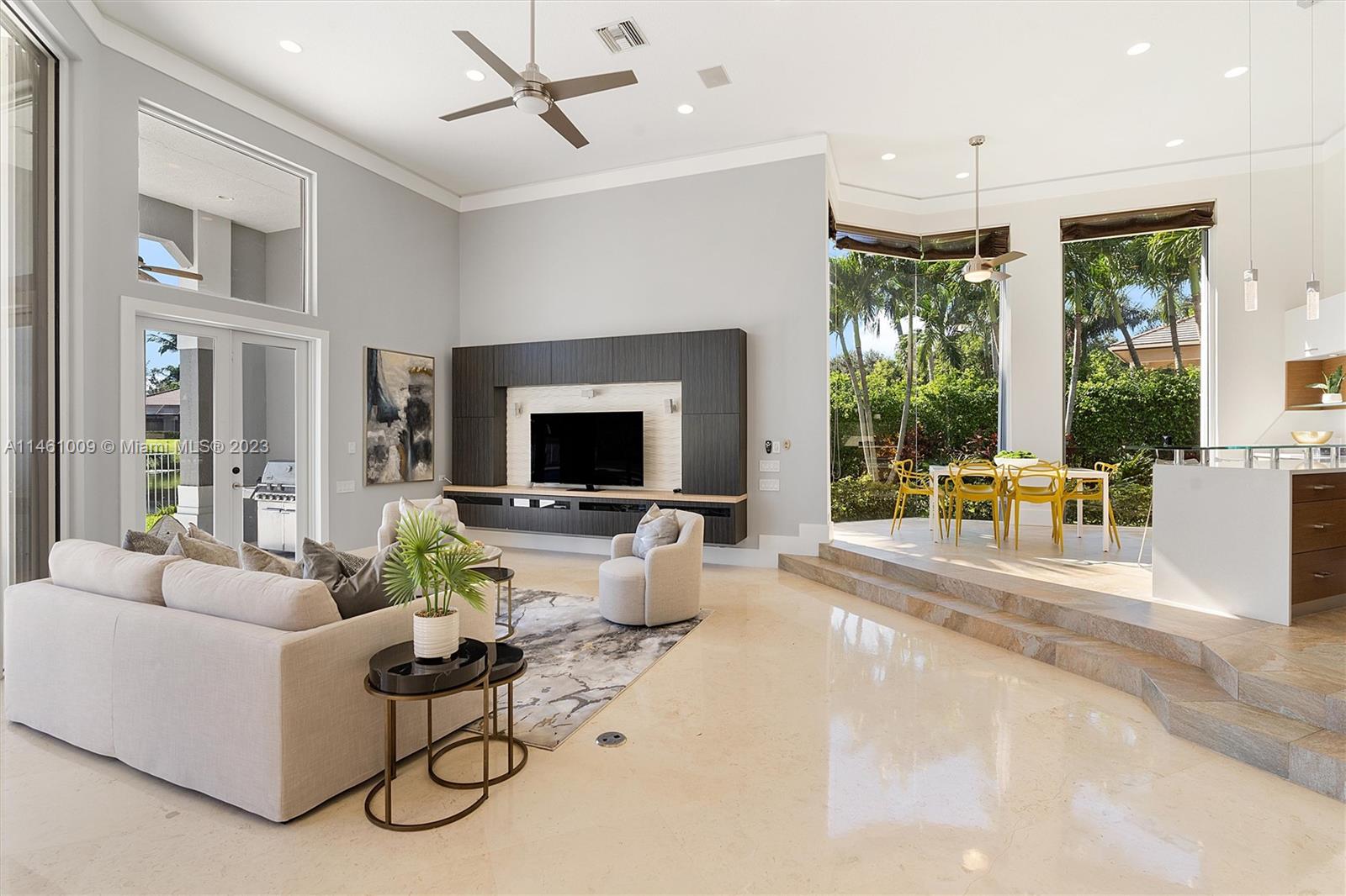 3088 Birkdale Drive Weston, FL 33332 - Photo 18 of 41 a living room with furniture and a flat screen tv