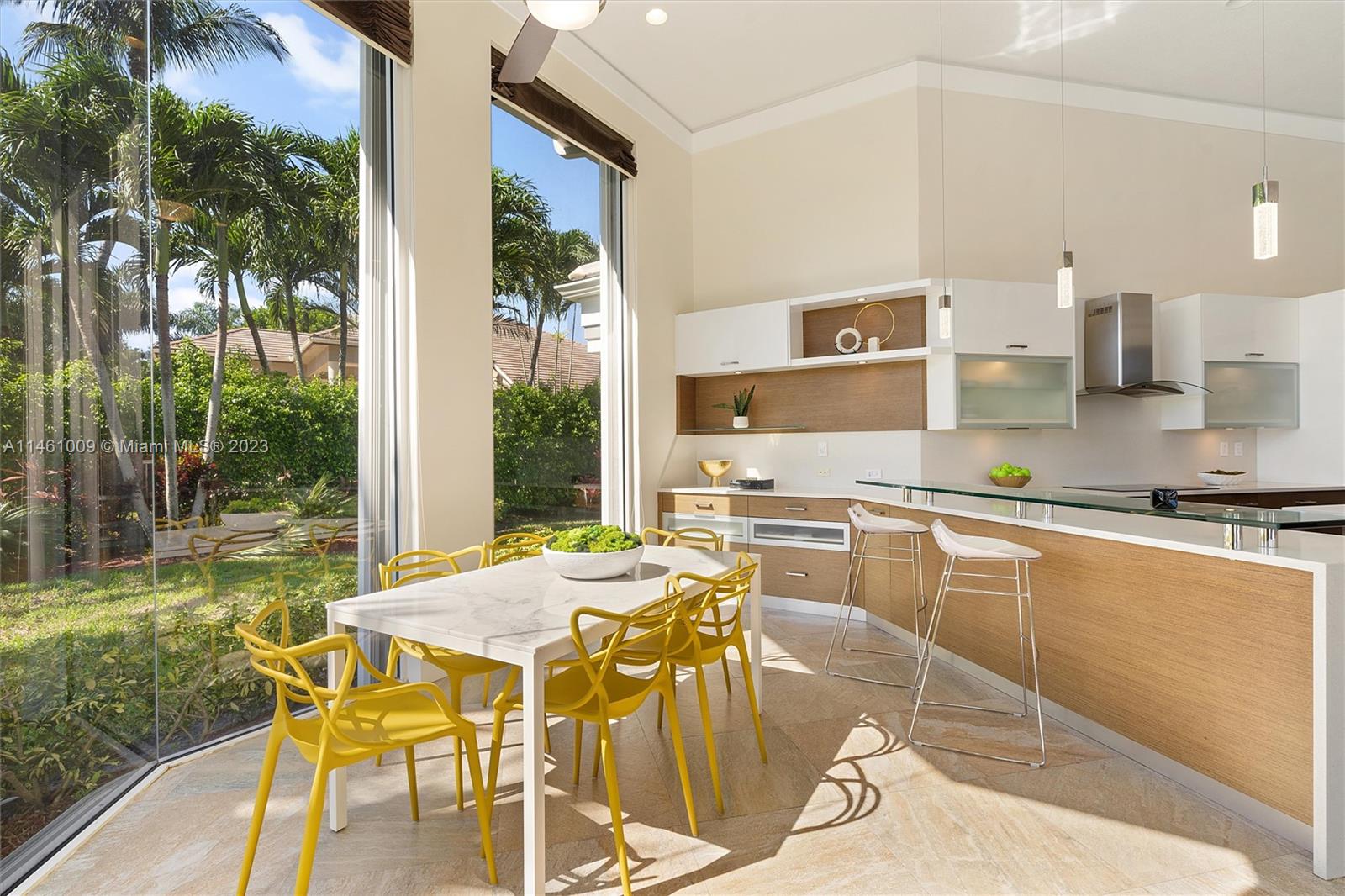 3088 Birkdale Drive Weston, FL 33332 - Photo 20 of 41 a view of a dining room with furniture and wooden floor