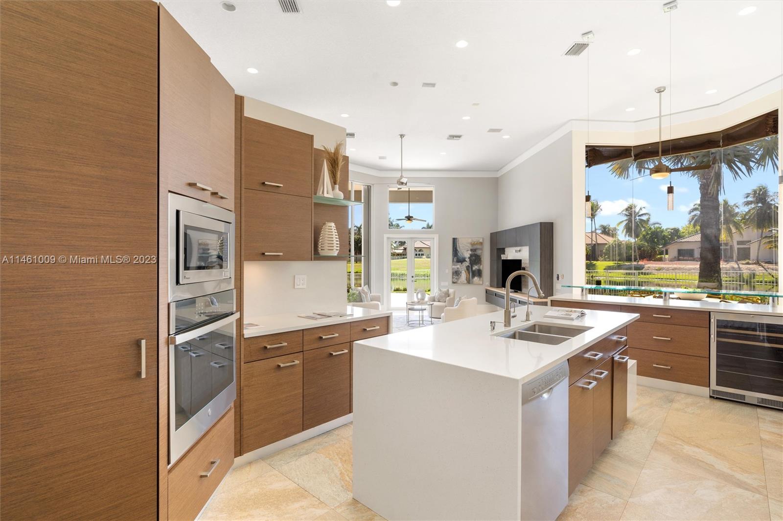 3088 Birkdale Drive Weston, FL 33332 - Photo 22 of 41 a kitchen with stainless steel appliances granite countertop a sink stove and refrigerator