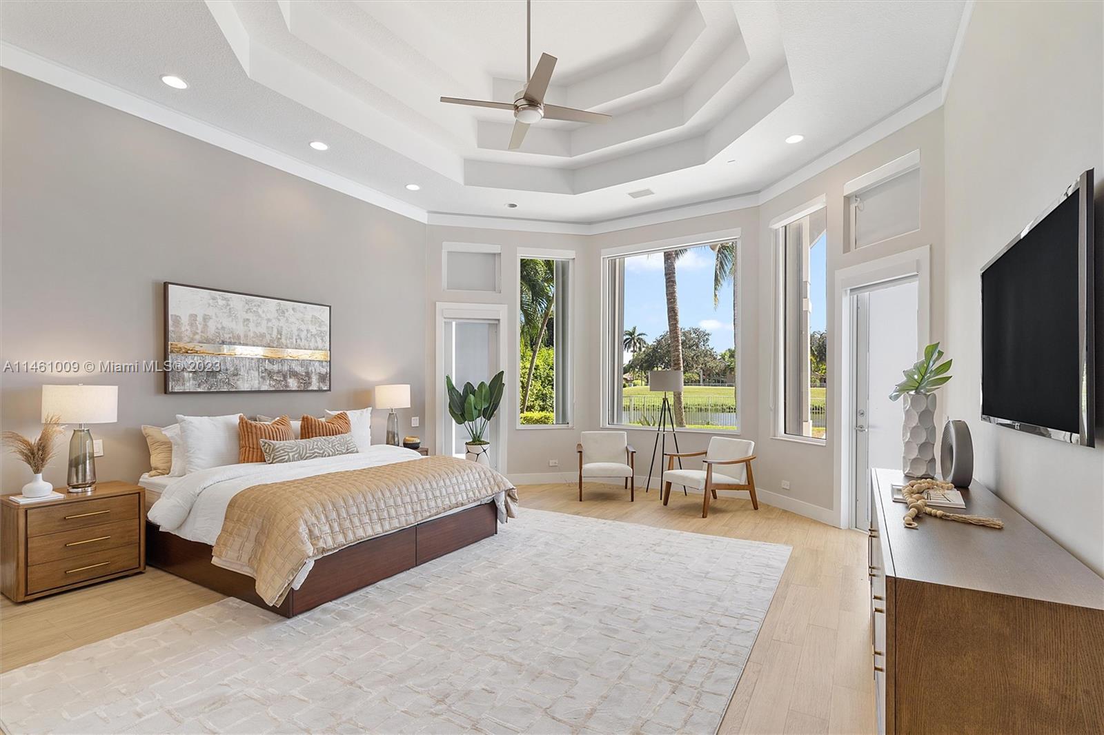 3088 Birkdale Drive Weston, FL 33332 - Photo 24 of 41 a bedroom with a large bed and a flat tv screen