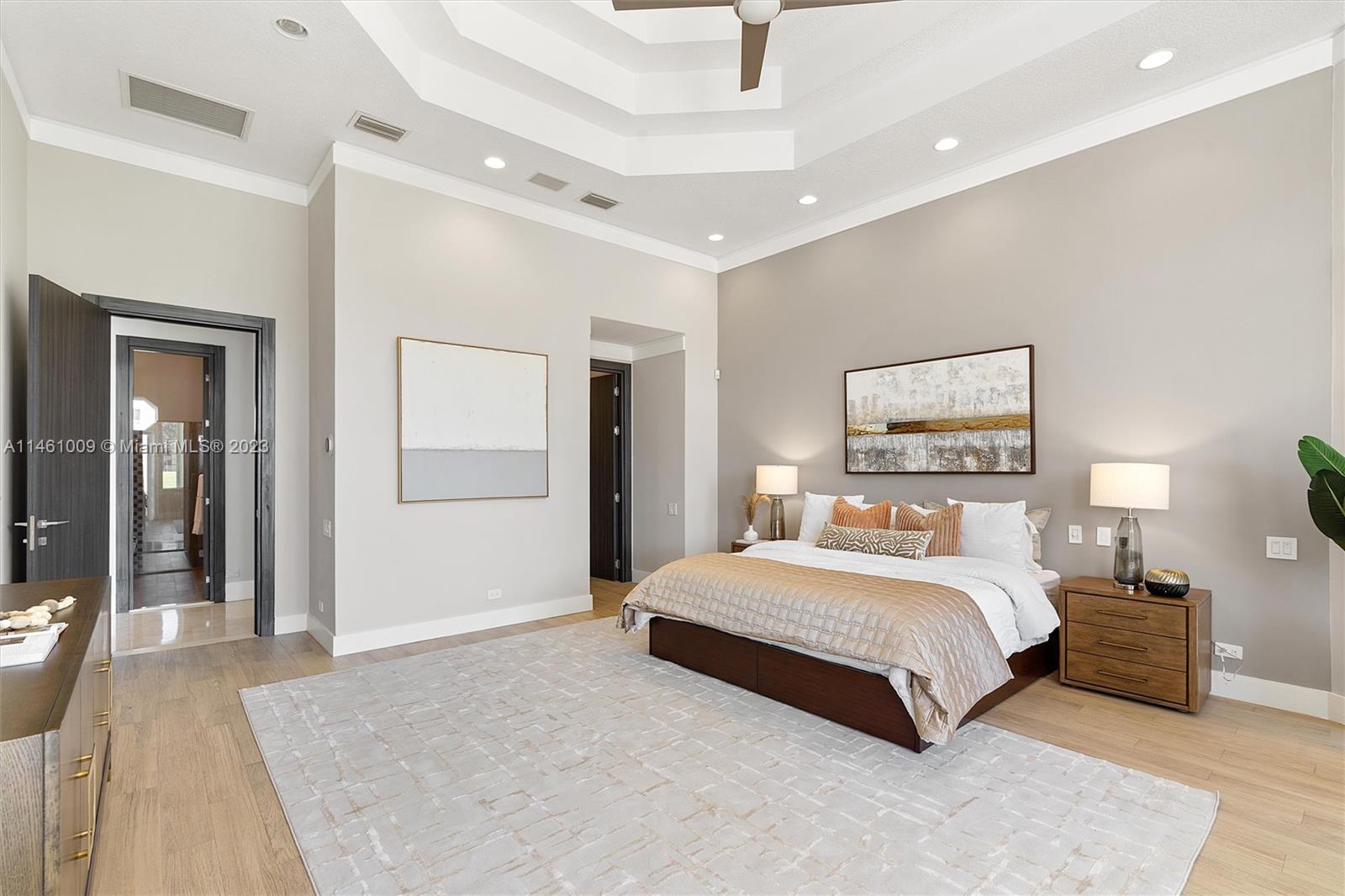 3088 Birkdale Drive Weston, FL 33332 - Photo 25 of 41 a bedroom with a large bed and a chandelier