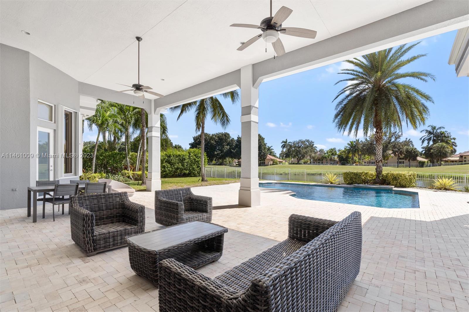 3088 Birkdale Drive Weston, FL 33332 - Photo 34 of 41 a living room with patio furniture and a large window