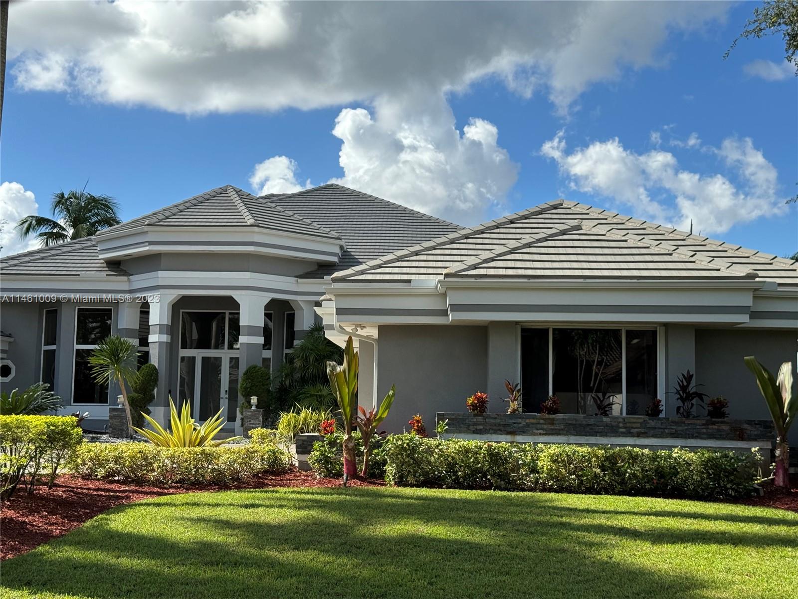 3088 Birkdale Drive Weston, FL 33332 - Photo 41 of 41 a view of a house in the front and a garden