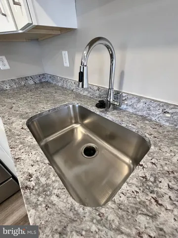 a view of a sink a counter space in a kitchen