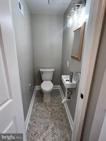 a bathroom with a sink and a toilet