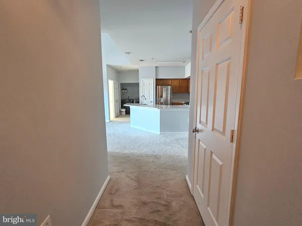 a view of a kitchen from the hallway