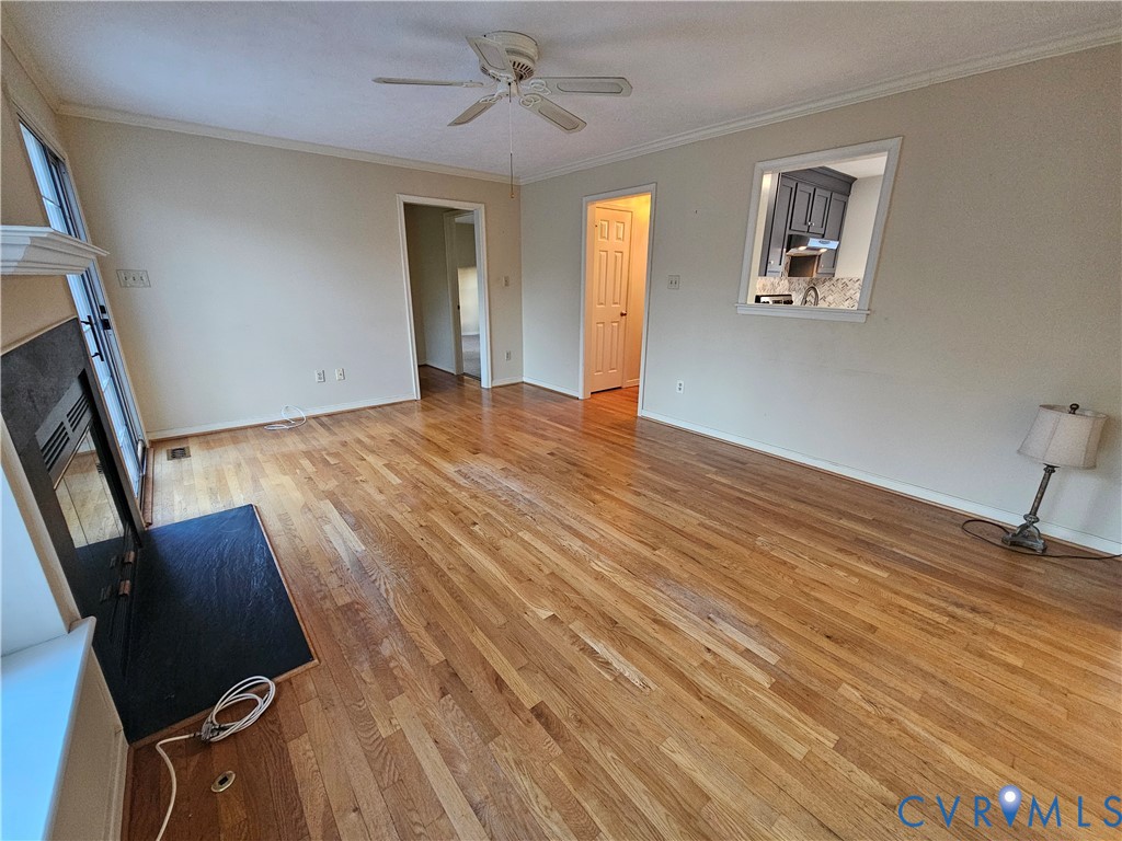8002 Galaxie Circle Henrico, VA 23228 - Photo 11 of 49 a view of an empty room with wooden floor and a window