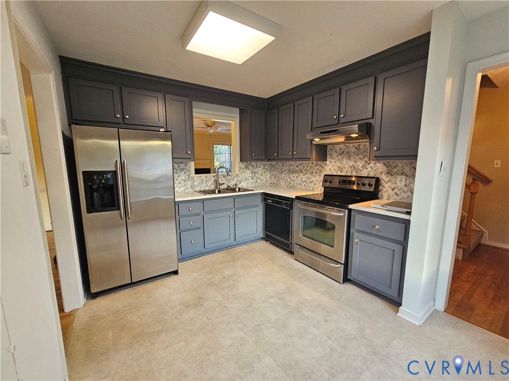8002 Galaxie Circle Henrico, VA 23228 - Photo 13 of 49 a kitchen with stainless steel appliances granite countertop a stove a sink and a refrigerator